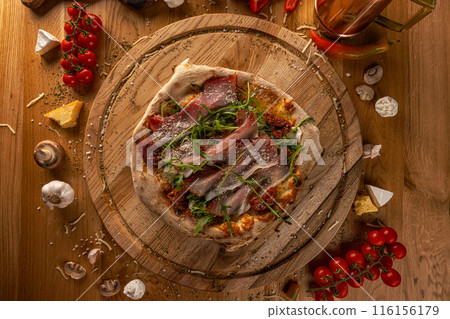 Artisan pizza with sun-dried tomatoes Artisan pizza with sun-dried tomatoes 116156179