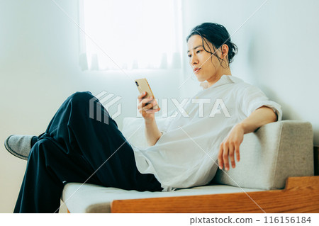 Men looking at smartphones Men looking at smartphones 116156184