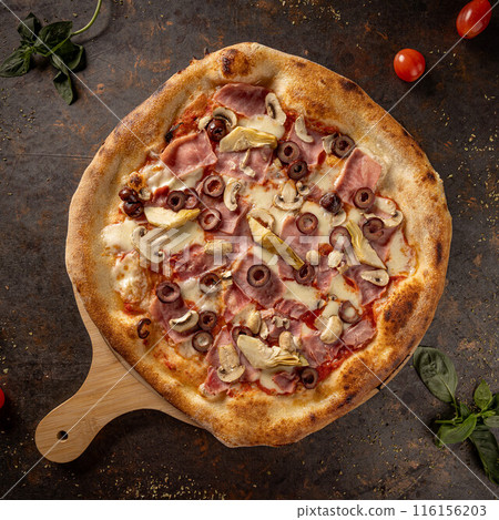 Italian pizza on rustic metal table 116156203