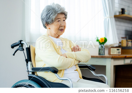 Senior woman in wheelchair worries Senior woman in wheelchair worries 116156258