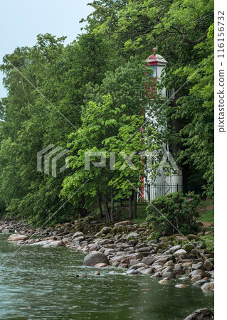 old lighthouse on the seashore among the trees old lighthouse on the seashore among the trees 116156732