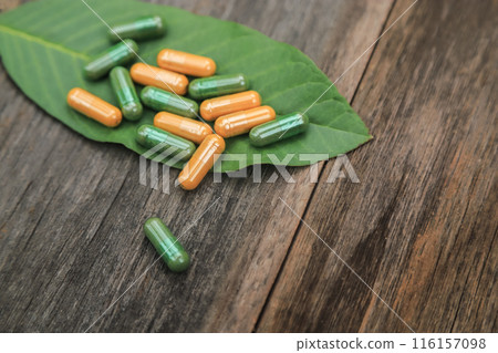 Green herbal capsules from herb for healthy eating in daily life with herb leaf 116157098