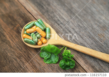 Green herbal capsules from herb for healthy eating in daily life with herb leaf 116157110