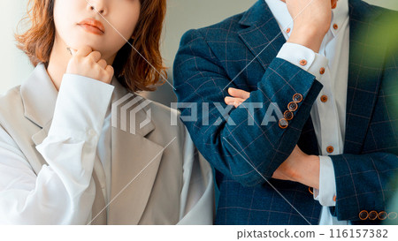 Male and female businessmen thinking with troubled faces 116157382