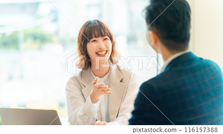 Male and female businessmen having a meeting Male and female businessmen having a meeting 116157388