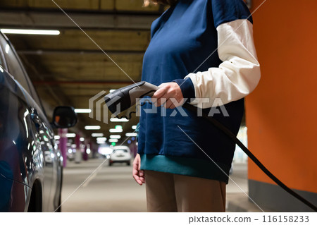 Manual car wash with pressurized water in car wash outside. Summer Car Washing. Cleaning Car Using High Pressure Water. Washing with soap. Close up concept. 116158233