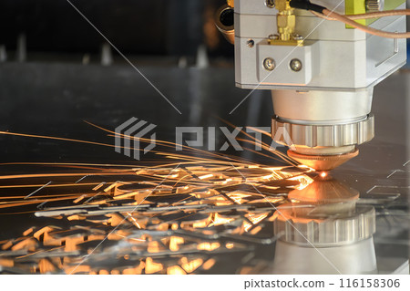 The fiber laser cutting machine  cut the metal plate with the sparkling light. 116158306