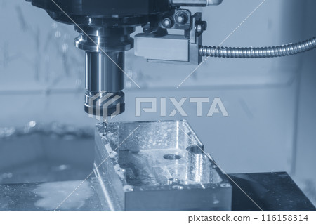 The CNC milling machine tapping process at  aluminum parts in the light blue scene. 116158314