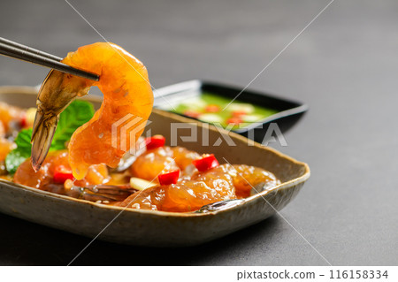 Pickled shrimp with chopstick Soy Sauce, chilli and garlic on stone background, Pickled shrimp with chopstick Soy Sauce, chilli and garlic on stone background, 116158334