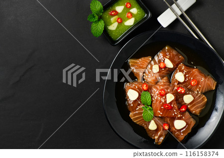 Top view of Pickled Salmon with Soy Sauce, chilli and garlic Top view of Pickled Salmon with Soy Sauce, chilli and garlic 116158374