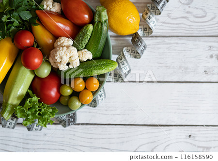 Large plate with various fresh farm vegetables. Autumn harvest and the concept of healthy organic food Large plate with various fresh farm vegetables. Autumn harvest and the concept of healthy organic food 116158590