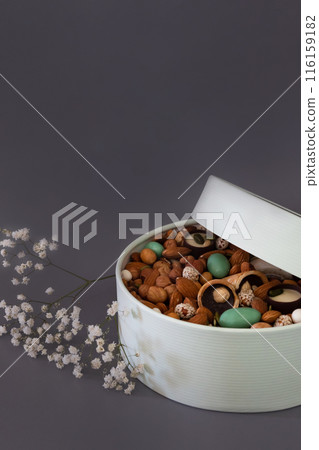 Peanuts in box. Gift to Women's Day (8 March), Women's Day. Mother's Day Valentines day. Festive round box. 116159182