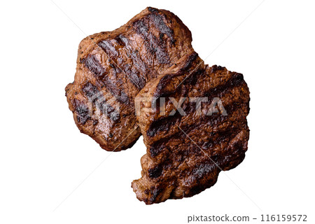 Fresh juicy delicious beef steak on a dark background Fresh juicy delicious beef steak on a dark background 116159572