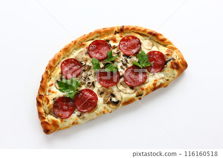 Petite pizza calzone on a white background 116160518
