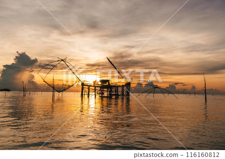 Villager large fish net lifting in Songkhla lake, Phatthalung, Thailand. Villager large fish net lifting in Songkhla lake, Phatthalung, Thailand. 116160812