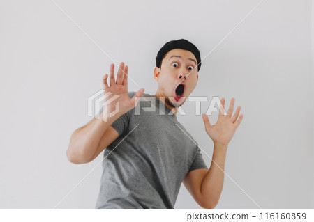 Wow and surprised face of man in grey t-shirt isolated on white background. 116160859