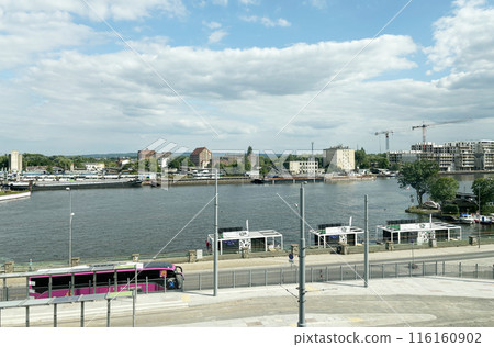 A view of the Oder River flowing through the Polish city of Szczecin (the left bank is in the foreground) and the area on the right bank is undergoing construction. A view of the Oder River flowing through the Polish city of Szczecin (the left bank is in the foreground) and the area on the right bank is undergoing construction. 116160902