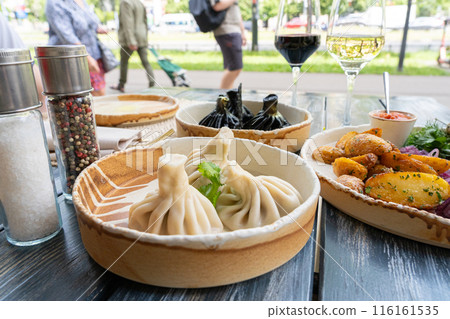 Georgian khinkali, minced meat chinkali, spicy dumplings also called dimsum, momo, jiaozi, manti 116161535