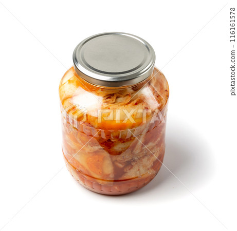Kimchee in a glass jar isolated. Spicy kim chi, hot fermented napa cabbage, jimchi, korean gimchi Kimchee in a glass jar isolated. Spicy kim chi, hot fermented napa cabbage, jimchi, korean gimchi 116161578
