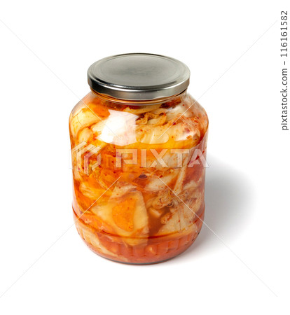 Kimchee in a glass jar isolated. Spicy kim chi, hot fermented napa cabbage, jimchi, korean gimchi Kimchee in a glass jar isolated. Spicy kim chi, hot fermented napa cabbage, jimchi, korean gimchi 116161582