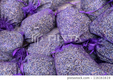 Dry lavender flowers in many bags, lavandula perfume buds, petals, fragrance lilac blossoms 116161619