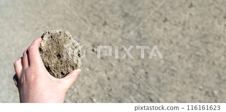 Volcano Stones in Hand, Volcanic Pumice with Glass, Pieces of Lava, Basalt Extrusive Igneous Rock Volcano Stones in Hand, Volcanic Pumice with Glass, Pieces of Lava, Basalt Extrusive Igneous Rock 116161623
