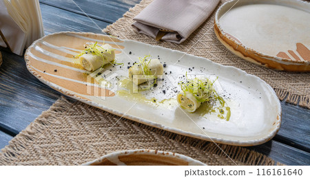 Rolls filled with ricotta cheese, stuffed canneloni cold appetizer, Georgian cuisine. White small shawarma 116161640