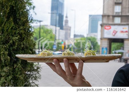 Rolls filled with ricotta cheese, stuffed canneloni cold appetizer, Georgian cuisine. White small shawarma Rolls filled with ricotta cheese, stuffed canneloni cold appetizer, Georgian cuisine. White small shawarma 116161642