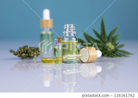 Hemp cbd oil, cannabis leaves, hemp seeds and bottles of oil Hemp cbd oil, cannabis leaves, hemp seeds and bottles of oil 116161762
