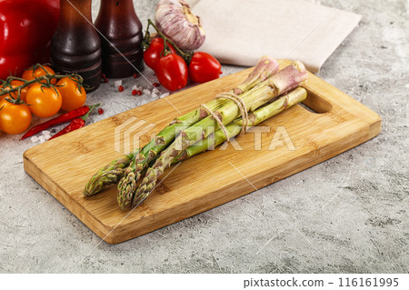 Raw green asparagus stem heap 116161995