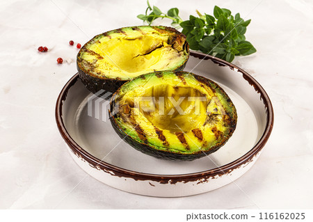Sliced fresh avocado on the grill Sliced fresh avocado on the grill 116162025