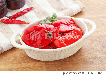 Marinated red bell pepper with oil 116162026