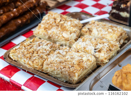 Napoleon cake, layers of puff pastry filled with creamy custard. Napoleon layered cake 116162102