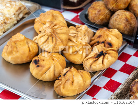 Fried khinkali, minced meat Georgian chinkali fritters, spicy dumplings dimsum, momo, jiaozi 116162104