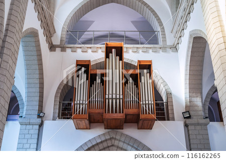pipes of church organ inside interior of Christian Catholic church. Cathedral of the Sacred Heart of Jesus in Tashkent in Uzbekistan 116162265