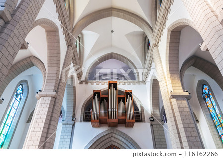 interior of Christian Catholic church with organ pipes on the wall. Sacred Heart of Jesus Cathedral in Tashkent 116162266
