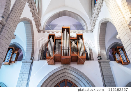 pipes of a church organ inside the interior of a Christian Catholic church. Cathedral of Sacred Heart of Jesus in Tashkent pipes of a church organ inside the interior of a Christian Catholic church. Cathedral of Sacred Heart of Jesus in Tashkent 116162267