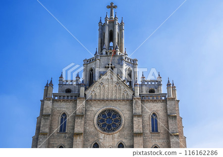 tower and spire of the gothic old ancient Catholic Cathedral. Polish Church Cathedral of the Sacred Heart of Jesus in Tashkent in Uzbekistan 116162286