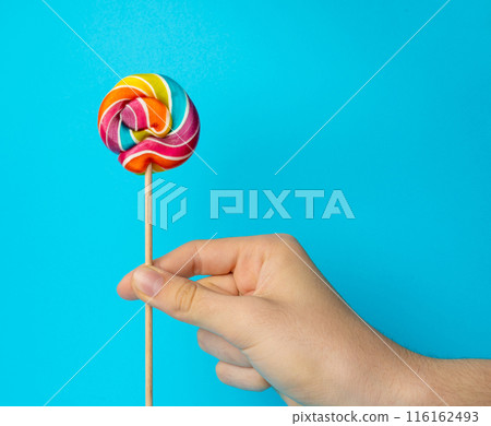 Color lollipop, spiral candy on stick, colorful striped lollypop, round fruit caramel, circle lollipop 116162493