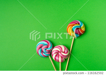 Color lollipop, spiral candy on stick, colorful striped lollypop, round fruit caramel, circle lollipop 116162502