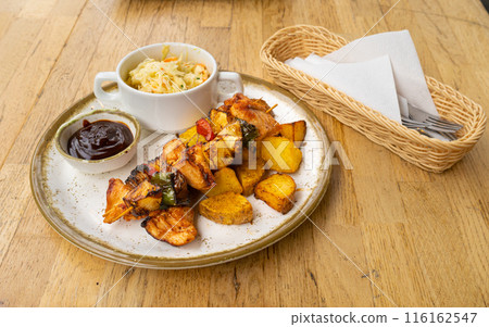 Poultry Shish Kebab, Barbecue Shashlik with Meat and Vegetables, Fruits, Peppers, Onions and Pineapple 116162547