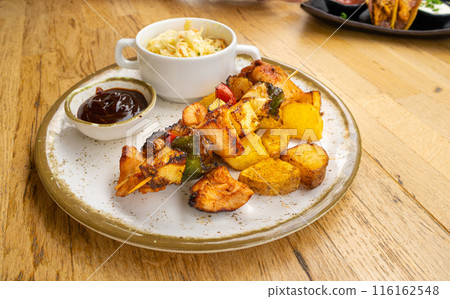 Poultry Shish Kebab, Barbecue Shashlik with Meat and Vegetables, Fruits, Peppers, Onions and Pineapple 116162548