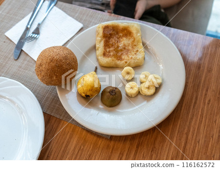 Moroccan hotel breakfast also known as ftour, msemen, coffee, fruits, harcha, mint tea, bread 116162572