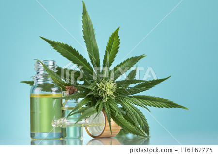 Hemp oil and marijuana leaves on hemp extract, cbd 116162775