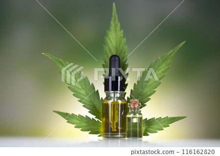 Hemp oil bottle with hemp leaf and cannabis leaf, marijuana 116162820