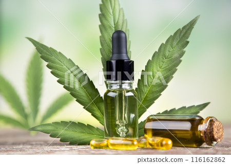 Oil cbd, cannabis and hemp leaves, medical marijuana concept Oil cbd, cannabis and hemp leaves, medical marijuana concept 116162862