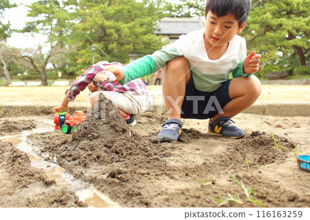 Children playing in the sandbox Children playing in the sandbox 116163259