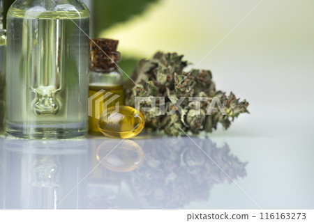 Hemp cbd oil, cannabis leaves, hemp seeds and bottles of oil Hemp cbd oil, cannabis leaves, hemp seeds and bottles of oil 116163273