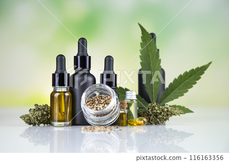 Hemp cbd oil, cannabis leaves, hemp seeds and bottles of oil 116163356