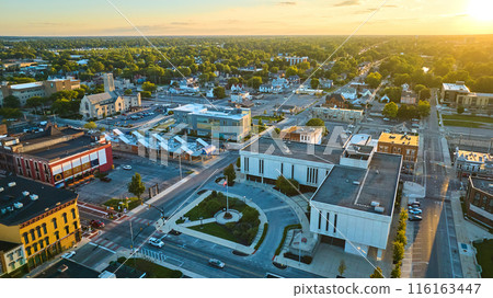 Courthouse, Muncie, IN at sunset with golden sun setting in aerial of downtown buildings Courthouse, Muncie, IN at sunset with golden sun setting in aerial of downtown buildings 116163447